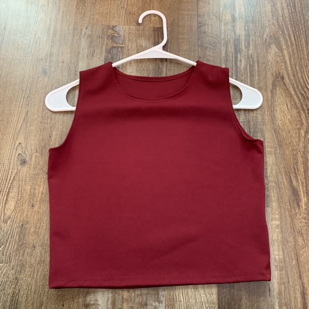 Two tight crop tank tops